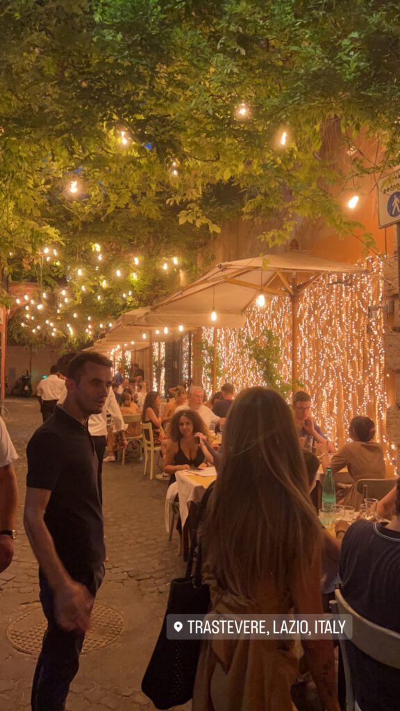 Trastevere at night - fairy lit cafes with outdoor seating on a summer night
